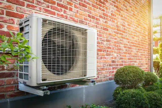 Heat Pump On Brick Wall Min 1 641x426 1