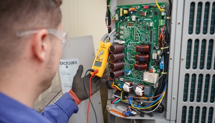 Tech Performing HVAC Inspection