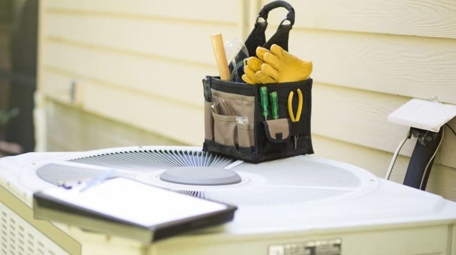 Toolbox sitting on top of AC unit.