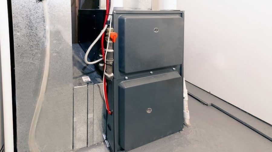 Residential furnace and ductwork in a utility room.