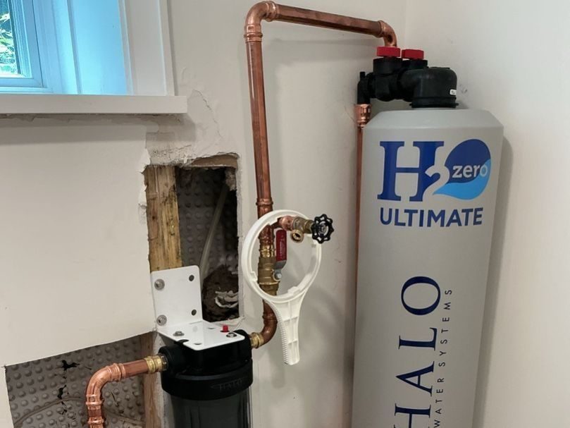 Tankless water heater installed in basement.