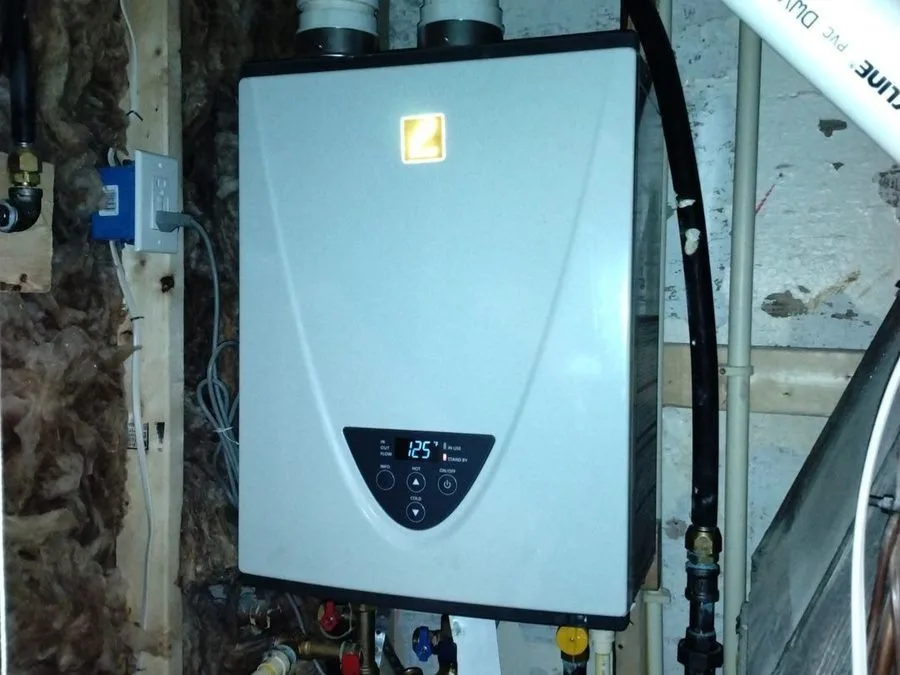 Tankless water heater installed in basement.