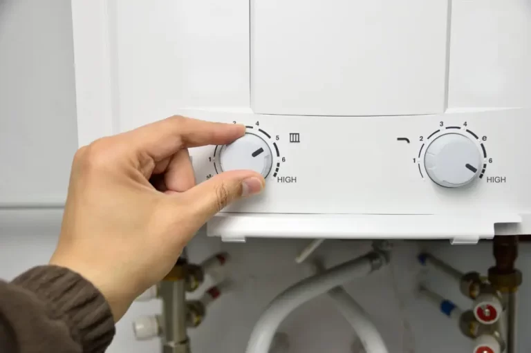 Man Adjusting Water Heater Min 1024x681 1