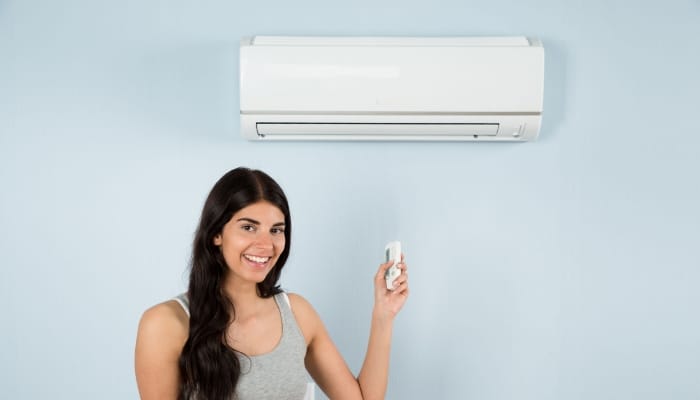 Woman With Ductless Mini Split Woman With Ductless Mini Split